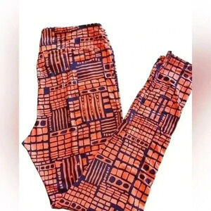 Lularoe TC (10-16) peach and navy blue abstract geometric leggings. NWOT .